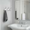 3-Hook Patterned Rail is an elegant, wall-mounted multi-hook utility rack designed to organize robes, towels, and clothing. Featuring a decorative, stylized aesthetic and a mirror-like finish, this multi-tiered storage hanger maximizes space on a single, unified backing track.