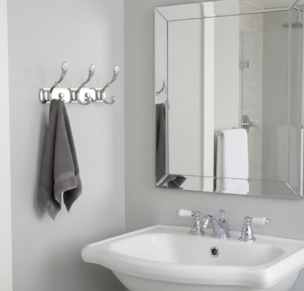 3-Hook Patterned Rail is an elegant, wall-mounted multi-hook utility rack designed to organize robes, towels, and clothing. Featuring a decorative, stylized aesthetic and a mirror-like finish, this multi-tiered storage hanger maximizes space on a single, unified backing track.