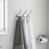 3-Hook Patterned Rail is an elegant, wall-mounted multi-hook utility rack designed to organize robes, towels, and clothing. Featuring a decorative, stylized aesthetic and a mirror-like finish, this multi-tiered storage hanger maximizes space on a single, unified backing track.