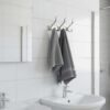 3-Hook Patterned Rail is an elegant, wall-mounted multi-hook utility rack designed to organize robes, towels, and clothing. Featuring a decorative, stylized aesthetic and a mirror-like finish, this multi-tiered storage hanger maximizes space on a single, unified backing track.