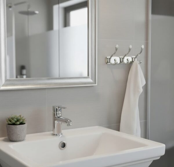 3-Hook Patterned Rail is an elegant, wall-mounted multi-hook utility rack designed to organize robes, towels, and clothing. Featuring a decorative, stylized aesthetic and a mirror-like finish, this multi-tiered storage hanger maximizes space on a single, unified backing track.